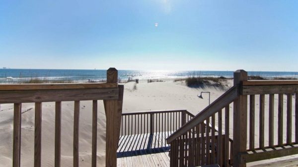 Enjoy the cottage feel of this beachfront vacation rental with fabulous sunrises and sunsets.