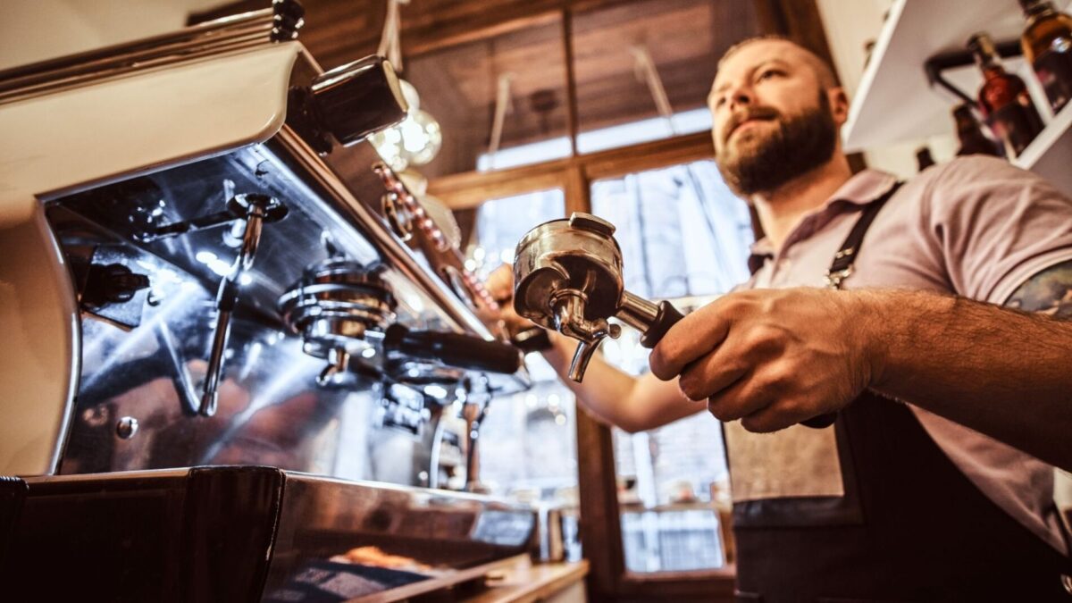 A barista making coffee near our Gulf Shores rentals