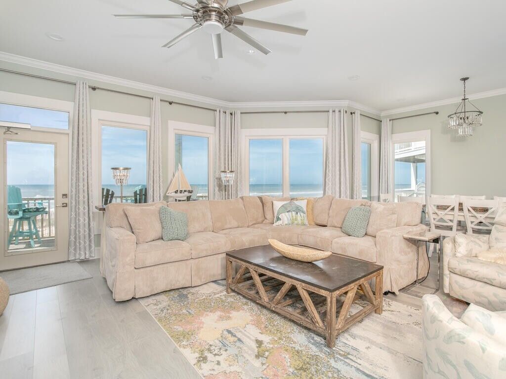 beachfront living room with a sectional and beachy decor